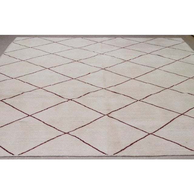 Moroccan Beni Ourain hand knotted rug with natural colors, with care using traditional rug-making techniques, this wool...