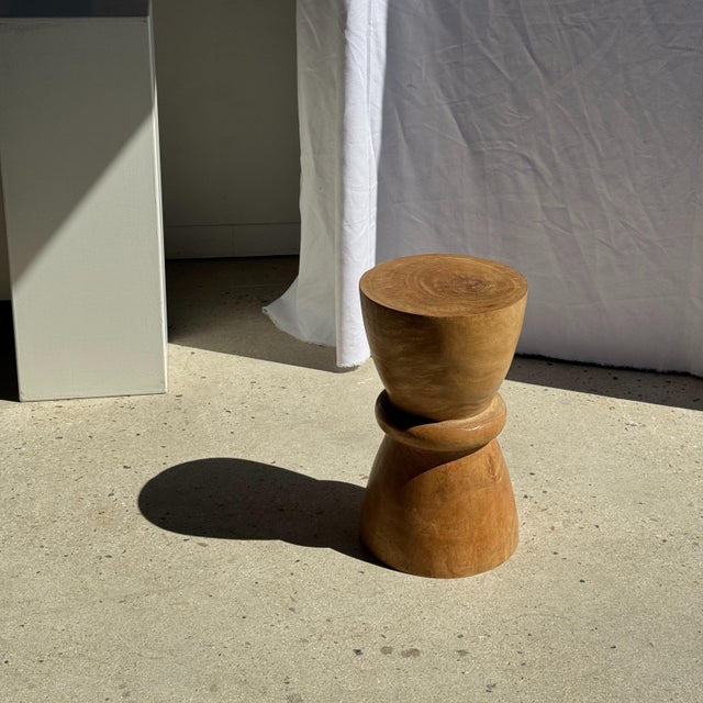 Stool, side table, or end table in natural solid mango wood. This modular piece of furniture features a geometric shape...