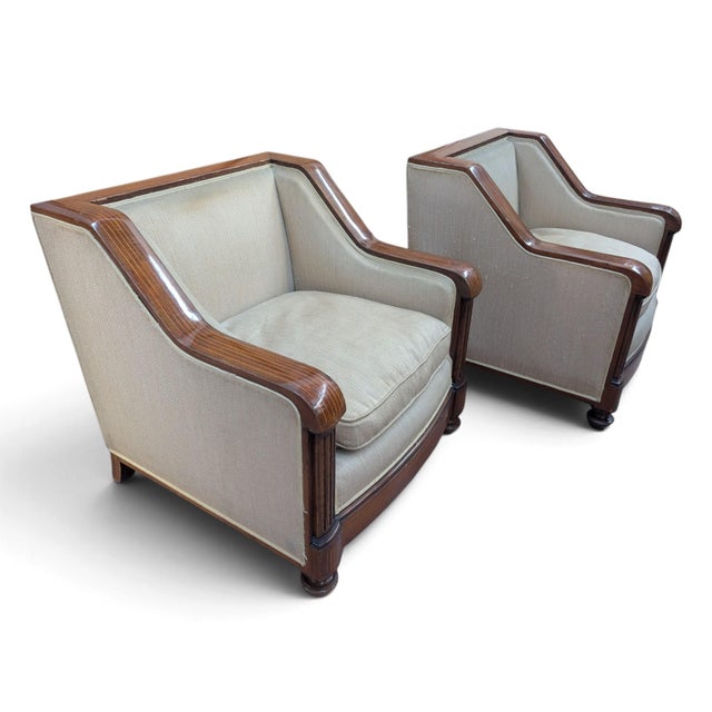 A refined pair of Art Deco club chairs, featuring a solid mahogany frame in excellent condition, demonstrating excellent...