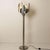 Spiral floor lamp by the reggiani manufactured, circa 1970. Stainless steel with hand blown murano glass sphere. A...