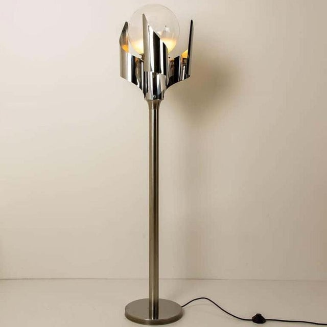 Spiral floor lamp by the reggiani manufactured, circa 1970. Stainless steel with hand blown murano glass sphere. A...