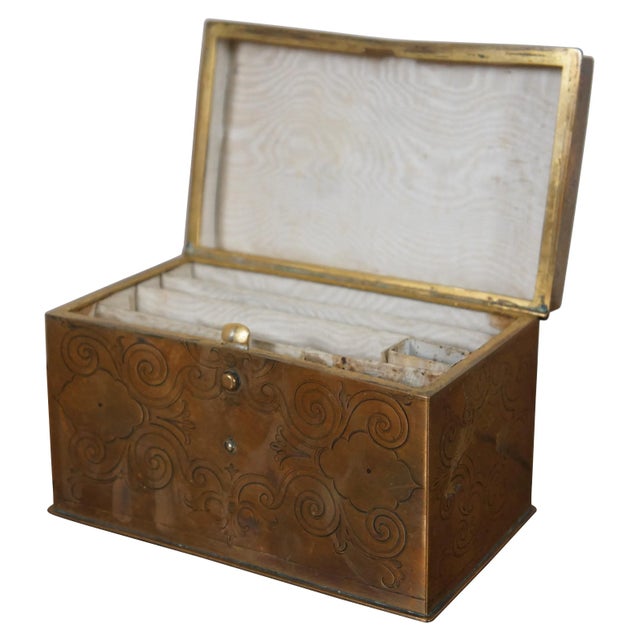 An early 20th century Art Deco era stationary box. Made from brass with etched brass exterior and divided interior.
