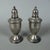 A refined pair of vintage amphora-shaped salt and pepper shakers, original with sterling weighted hallmarks from the early...