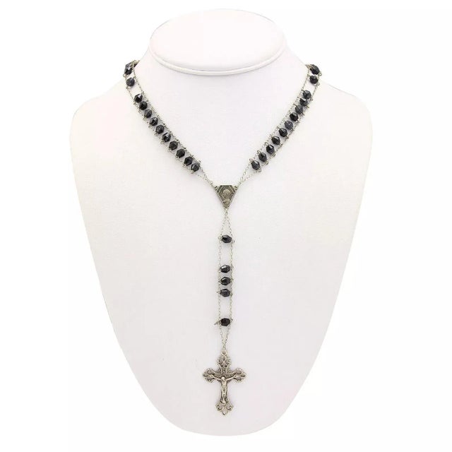 This magnificent antique silver and onyx rosary necklace is crafted in 800 silver with a double strand chain link and oval...
