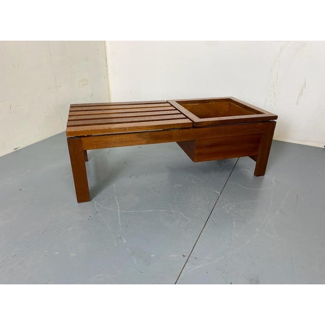 Nice Mid Century Modernist Teak Slat Bench coffee/ side table with plant stand.