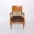 A fine pair of Neoclassical armchairs. Karelian Birch with carved details and central carved giltwood detail on the backrest.