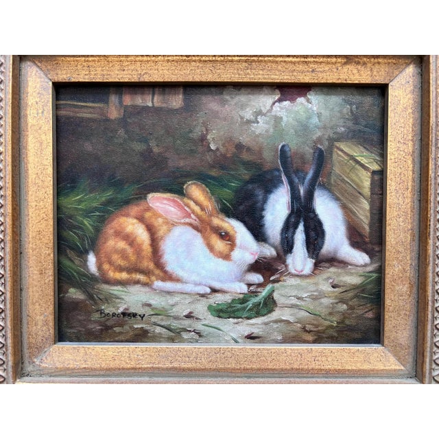 This is a sweet, framed oil painting of bunnies sharing a lettuce leaf that is mounted in thick gold-tone frame with pale...