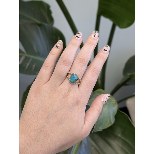 This beautiful ring features a 2.47 carat cushion cut Turquoise gemstone with natural earth mined diamonds and a split...