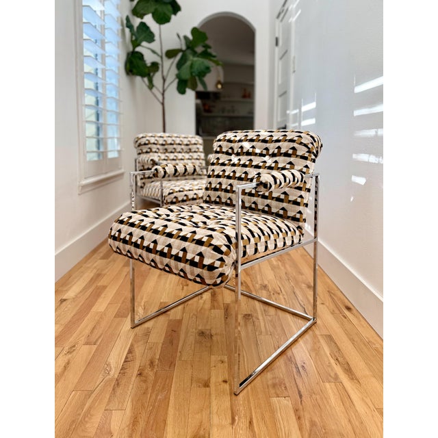 Sleek and groovy pair of chrome armchairs designed by Milo Baughman for Thayer Coggin, c.1970s. Reupholstered in a retro...
