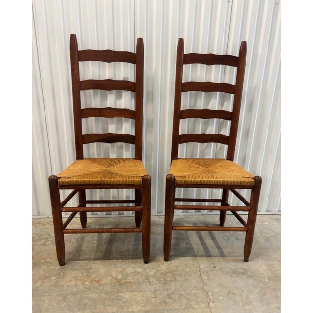 Classic pair of vintage tall ladder back rope seat dining chairs. No Makers marks but quality is excellent. Super sturdy...