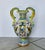Italian majolica vase with hand painted tin glaze over earthenware ceramic pottery. Handmade with stylized face handles...