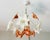 Vintage Mid-Century Italian Murano Style Amber Brown & Opaline White Glass Floral Chandelier Bring warm vintage charm into...