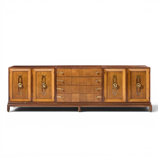 Renzo Rutili For Johnson Furniture Mid Century Walnut and Brass Credenza This credenza measures: 101 wide x 20.75 deep x...