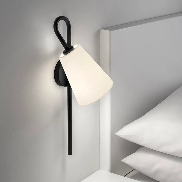 An Elegantly Tall Vertical Column Loops And Crosses Over The Top To Hold A Fabric Shade. The Wall Light Is Available Left...