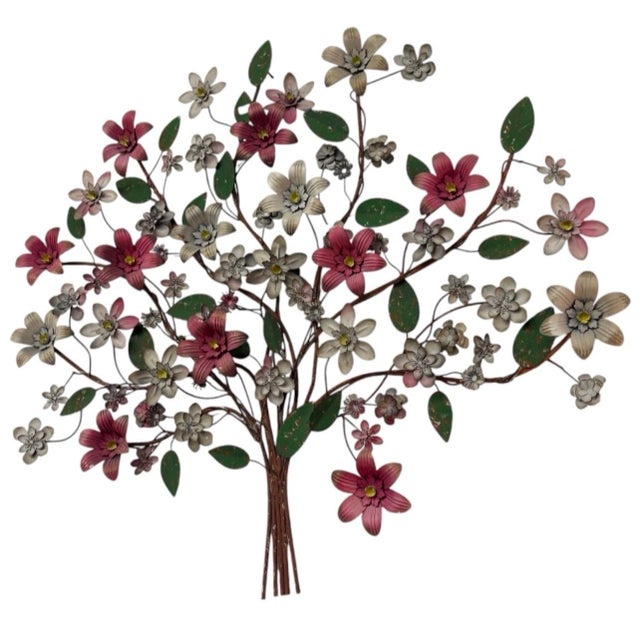 Add a touch of vintage charm and botanical elegance to your living space with this striking metal wall sculpture. Crafted...