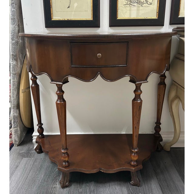 A beautifully crafted half-round console table by Alfonso Marina, a brand celebrated for its artisanal craftsmanship and...