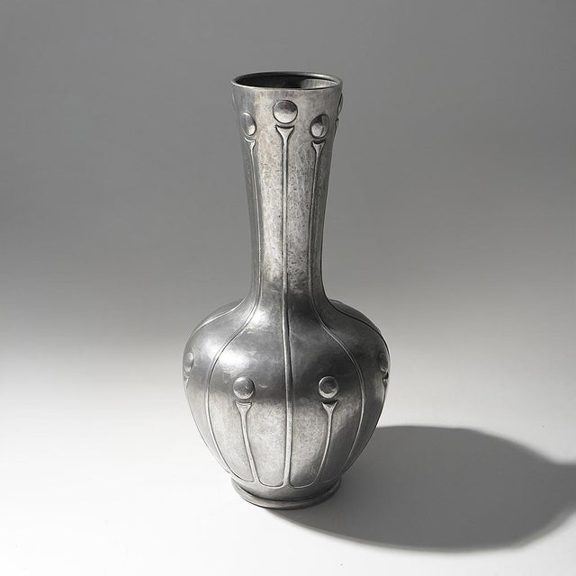 A Bellotti pewter vase from the 1920s, characterised by a composition that reflects the gradual transition from the...