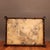 This elegant rectangular serving or tea tray features a striking juxtaposition of materials. The center is inset with a...