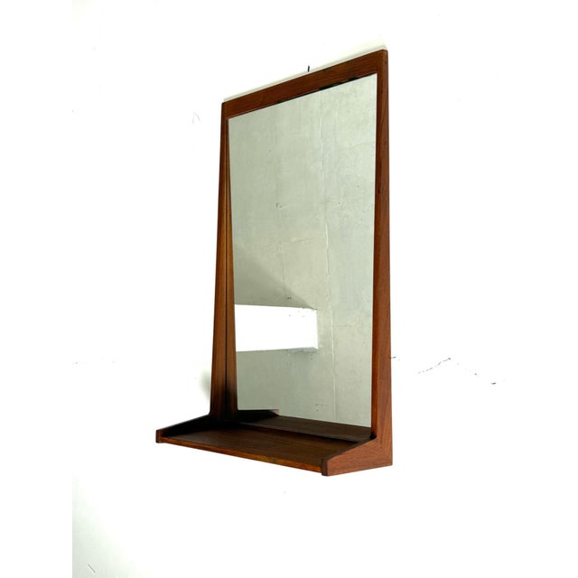 Aksel Kjersgaard teak mirror, Odder, 1960s An elegant and timeless wall mirror designed by Aksel Kjersgaard and...