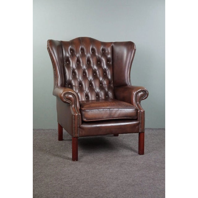 This fantastic Chesterfield brown leather armchair. This armchair has a very high -quality seating comfort and the...