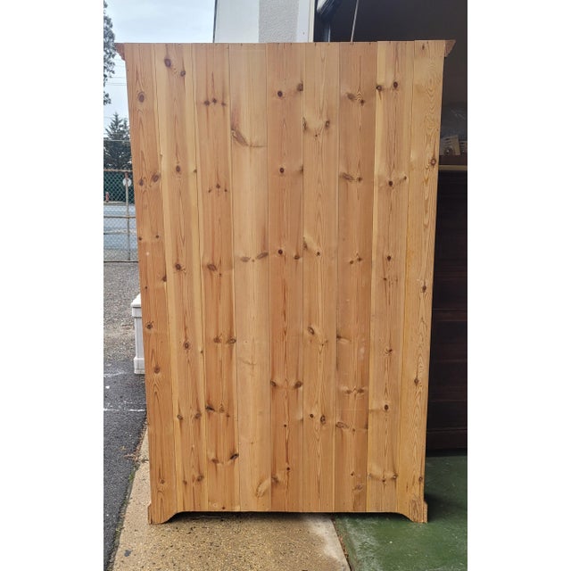 Fine large knotty pine tall bookcase. Features 5 adjustable shelves, paneled sides and crown cornice. Measures 79 inches...