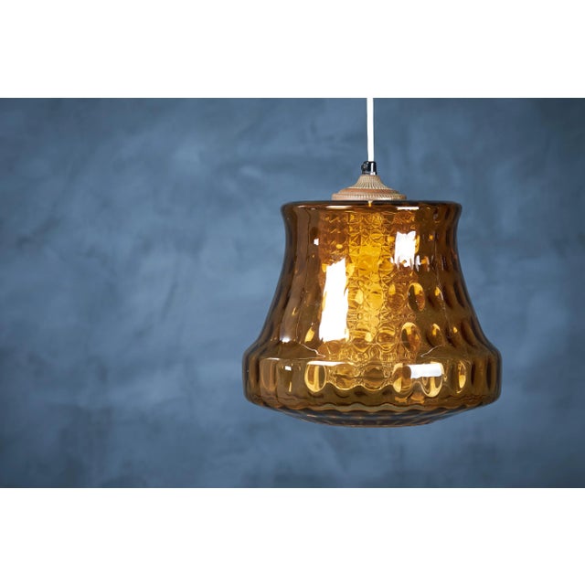 This is a beautiful shaped green crystal pendant with an inner shade made in clear crystal that is attributed to the...