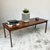 Mid-century Brazilian rosewood coffee table designed by Ole Wanscher, featuring a floating top supported by elegantly...