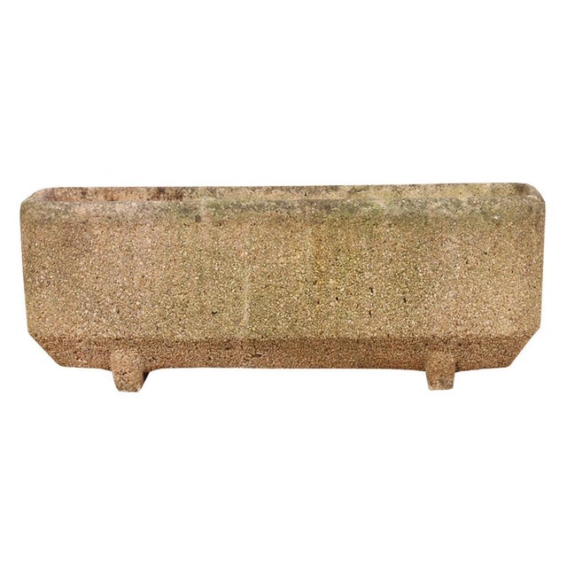 A striking set of four cast stone planters from France. Exemplifying the Modernist aesthetic, each planter features a...