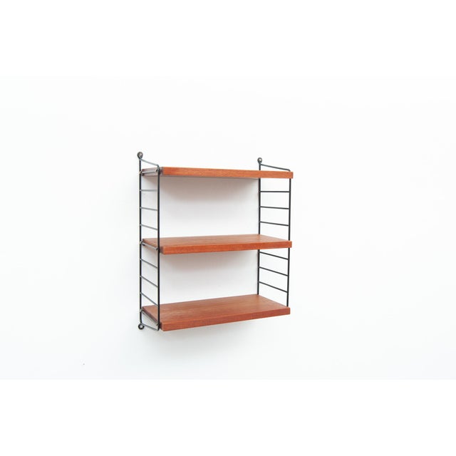 String shelving system with 3 shelves and 2 ladders in walnut Design: Kajsa & Nils "Nisse" Strinning Width 41 cm Height 52...