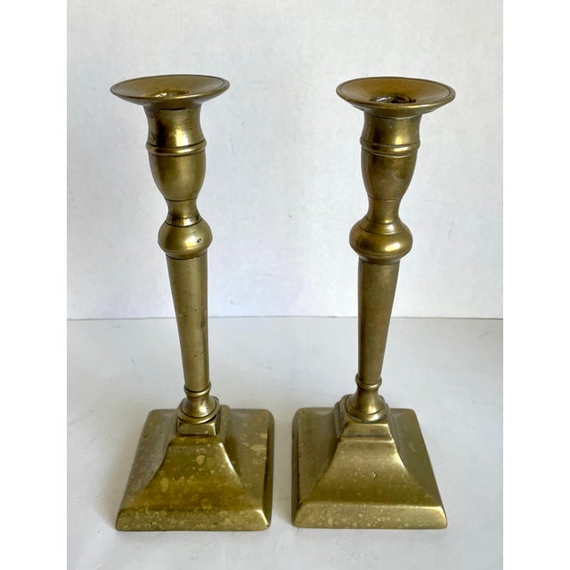 Here is a beautiful pair of Georgian brass candlestick holders, dating to around 1780–1820. They have that classic late-...