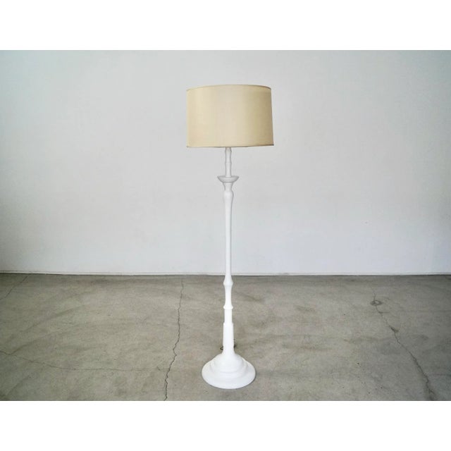 Vintage 1960's Hollywood Regency floor lamp for sale. Made of solid wood, and has a white shabby chic finish. It was...