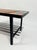 A nice piece of french modernist design, this coffee table combines a warm wood and ceramic tile top with a sleek black...