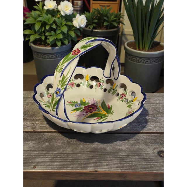 This Vintage Portugal Hand-Painted Floral Basket is a beautifully crafted decorative piece that adds a touch of elegance...