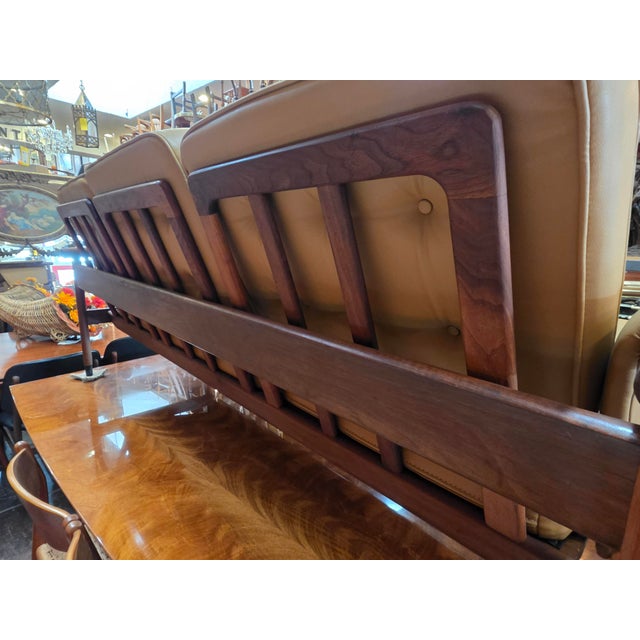A very nice walnut Mid-Century Walnut wood Sofa. All original Faux leather cushions (Vinyl). Sturdy and ready to go! The...