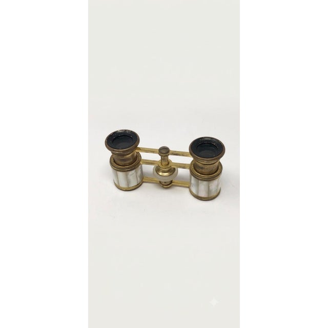 Up for sale is a stunning and uniquely compact pair of antique Turn-of-the-Century opera glasses, retailed by the renowned...