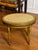 An early 20th century French Louis XVI style walnut oval tabouret stool or side table fitted with a woven cane top. Finely...