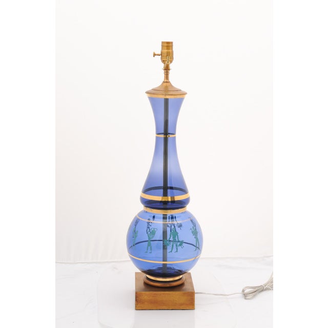 These vintage mid-century Marbro cobalt blue glass lamps feature an elegant double-globe/hourglass shape accented with...