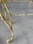 A whimsical vintage set of three Hollywood Regency stacking tables featuring hand-laid mosaic tops with playful monkeys,...