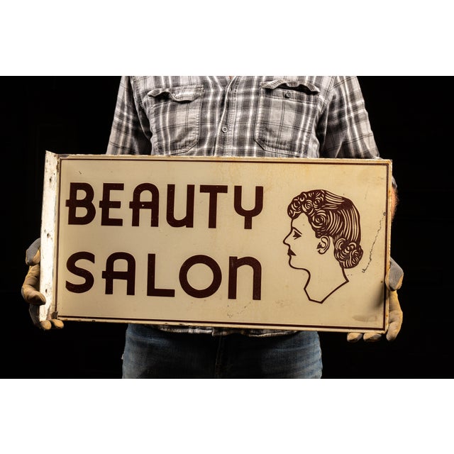 Early 20th-century double-sided porcelain enamel storefront sign advertising a beauty salon. Designed for perpendicular...