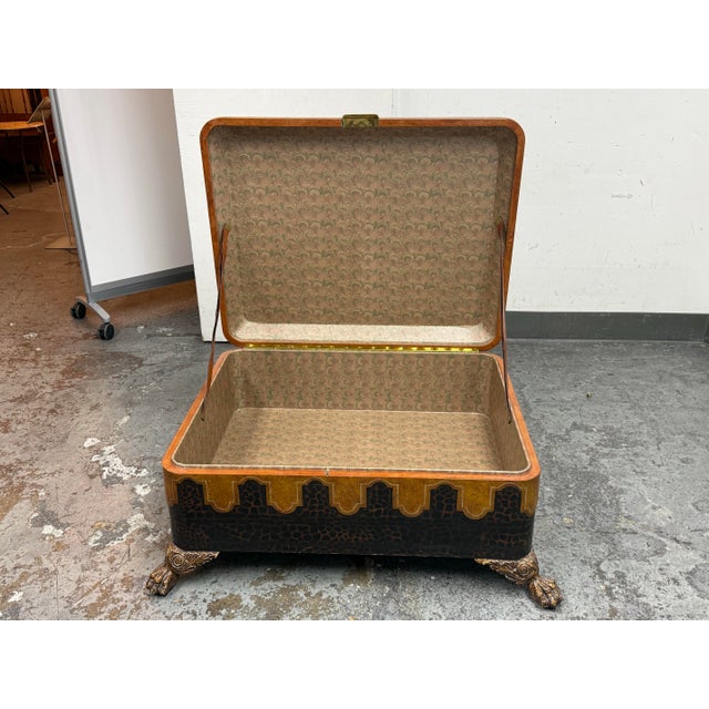 Design Plus Gallery presents a Vintage Leather-Clad Storage Coffee Table on Paw Feet by Maitland-Smith. The table has a...