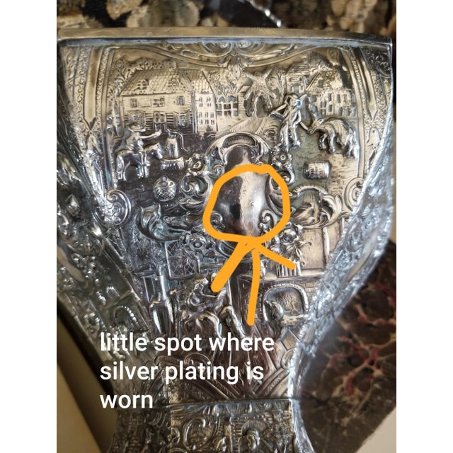 Great looking antique Dutch style silver plated basket with handle. There are some bends in the metal and one tiny spot...