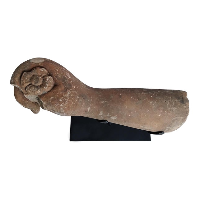 A hand fragment holding a scroll, reclaimed from a Khmer stone statue. East Thailand, early 20th Century. Hand-carved in...