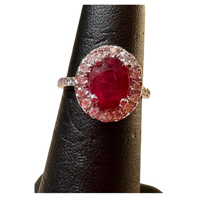 Introducing a truly stunning piece, behold the 3 Carat Oval Treated Ruby &amp; 1.25 ct Diamond Ring in exquisite 14 Karat...