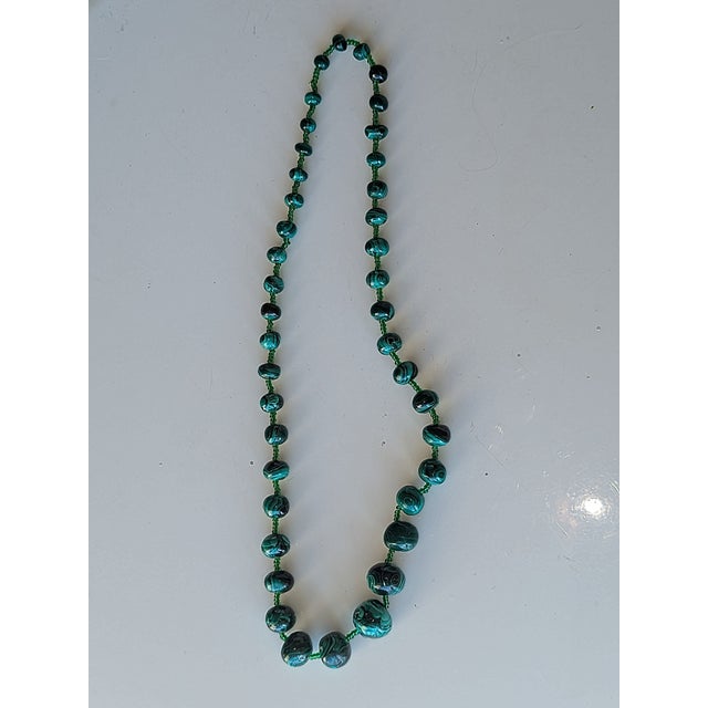 Graduated Malachite beaded 22". Purchased in the 70's from the Zaire (now the Congo). It is hand strung uniquely without a...