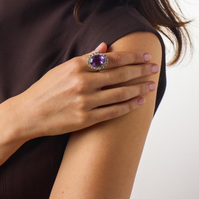 This enchanting Victorian amethyst and diamond cluster ring from the 1900’s is a beautiful antique jewel with rich color,...