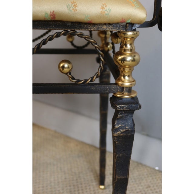 Original 20th-century wrought iron bench in very good condition. DIMENSIONS: 0.63m high, 0.56m seat height. 0.58m long,...