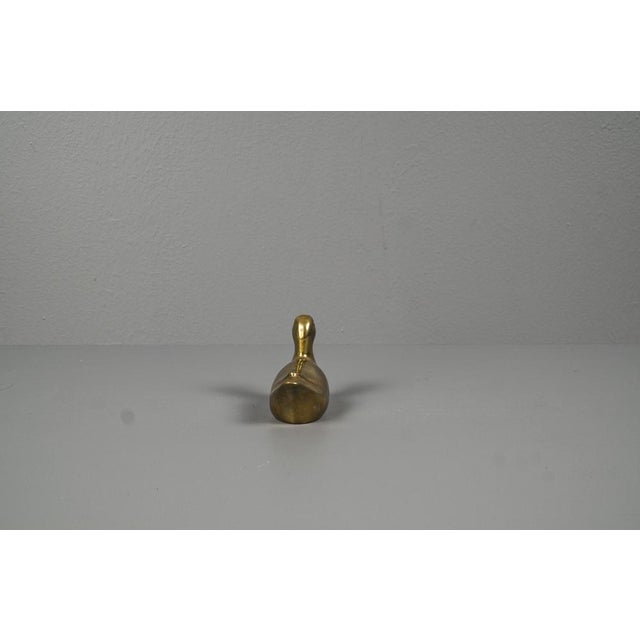Brass duck small hand charm. Ducks from the 70's made in brass. The duck looks in the original patina has been preserved....