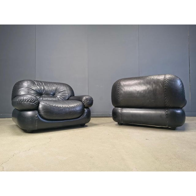 Pair of black leather lounge chairs model by Sapporo for Mobil Girgi. Very thick and comfy cushions upholstered in fine...