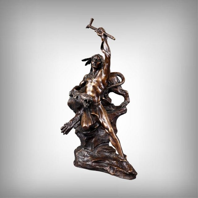 This bronze sculpture with a brown patina powerfully embodies the heroic aesthetic characteristic of Buck McCain’s work....