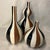 This is a vintage Jonathan Adler "Happy Home" Stripes ceramic vase set from 2003, featuring bulbous and bud silhouettes...
